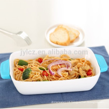 white ceramic bakeware with heat-resistant silicone handles